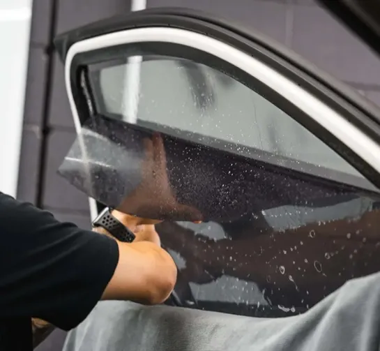Applying Tinting on Luxury Car